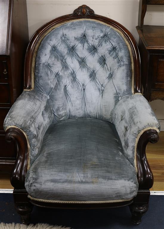 A pair of Victorian rosewood buttoned armchairs